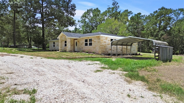 view of front of home with a carport