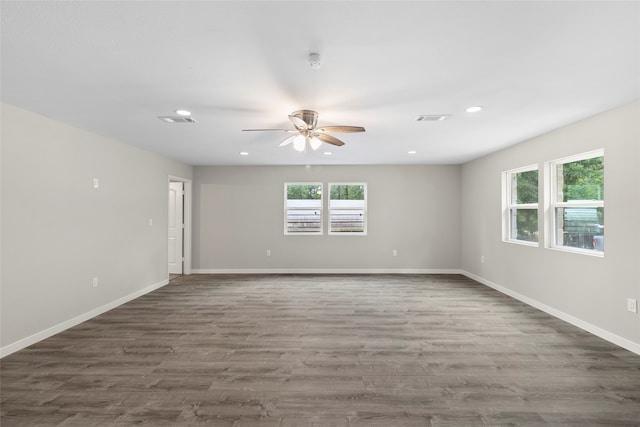 spare room with ceiling fan and hardwood / wood-style floors