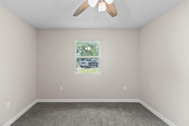 empty room with carpet flooring and ceiling fan