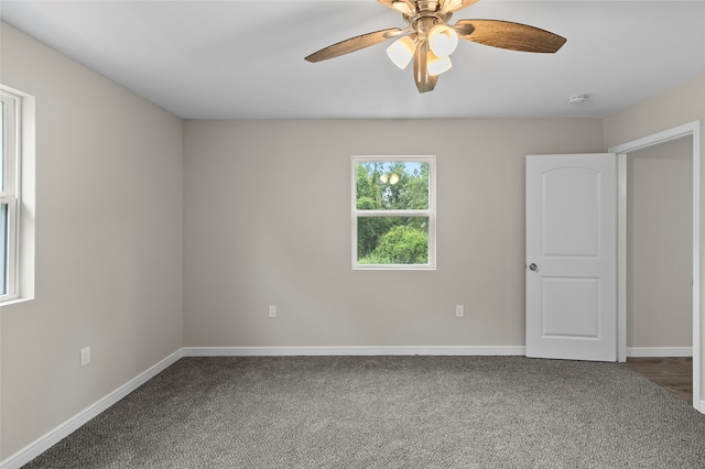 unfurnished room with carpet floors and ceiling fan