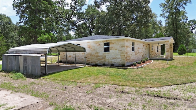 exterior space with driveway, a lawn, and a carport