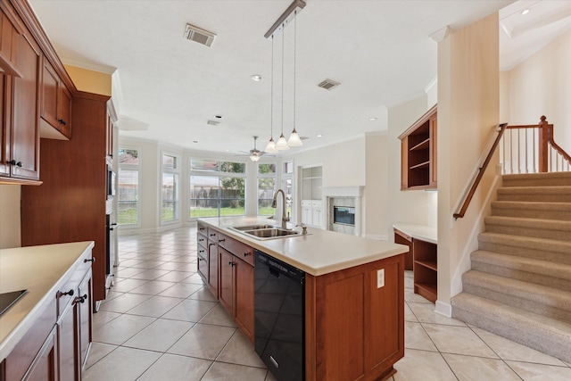 kitchen with a kitchen island with sink, dishwasher, hanging light fixtures, ceiling fan, and sink