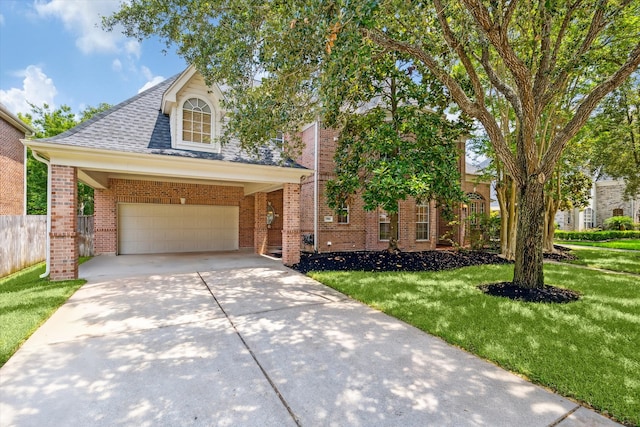 view of front of house with a garage and a front lawn