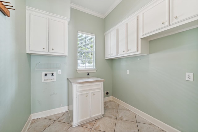 clothes washing area featuring hookup for a washing machine, crown molding, light tile patterned floors, cabinets, and hookup for an electric dryer