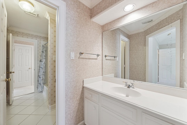 bathroom with ornamental molding, shower / bath combo with shower curtain, vanity, and tile patterned flooring