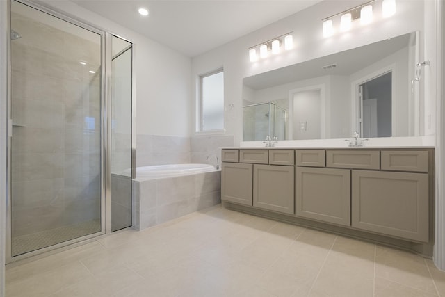 bathroom with tile patterned flooring, plus walk in shower, and vanity