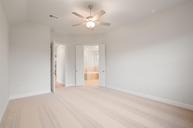 empty room featuring light carpet and ceiling fan