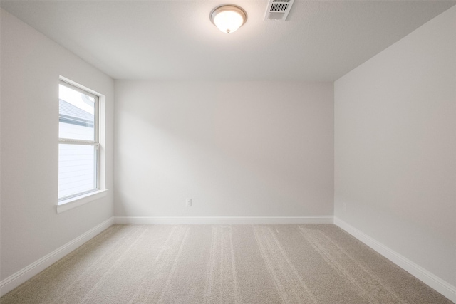 empty room with carpet flooring