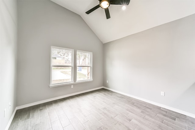 unfurnished room featuring light hardwood / wood-style flooring, ceiling fan, and lofted ceiling