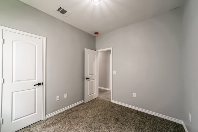 unfurnished bedroom with carpet floors