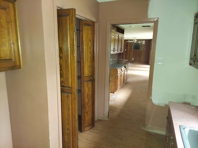 hallway featuring hardwood / wood-style flooring