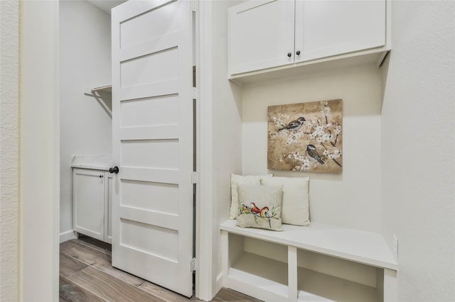 mudroom with light hardwood / wood-style floors