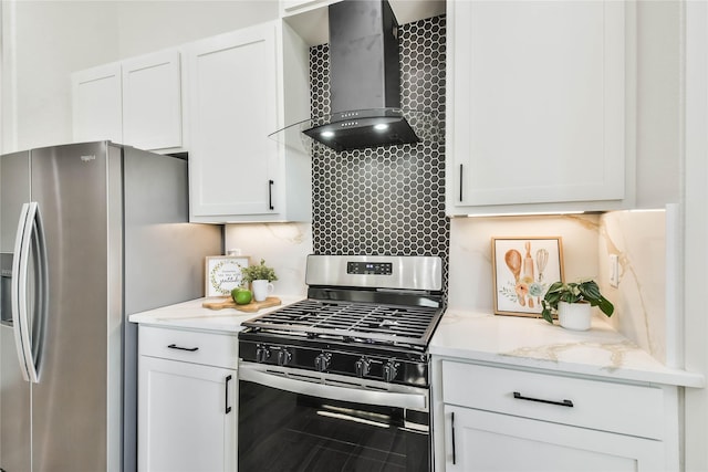 kitchen with white cabinets, decorative backsplash, stainless steel appliances, and wall chimney exhaust hood