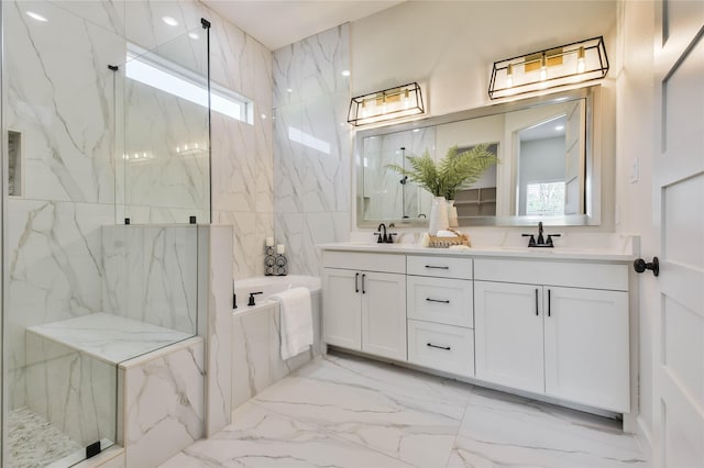 bathroom with vanity and a shower with door