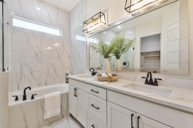 bathroom with vanity and a bathtub