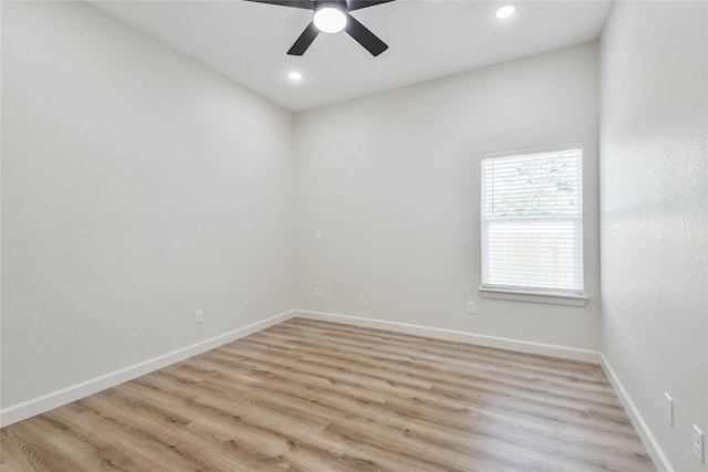 unfurnished room with ceiling fan and light hardwood / wood-style flooring