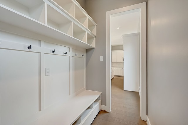 mudroom with light hardwood / wood-style floors