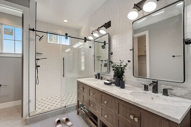 bathroom featuring vanity, tile patterned flooring, and an enclosed shower