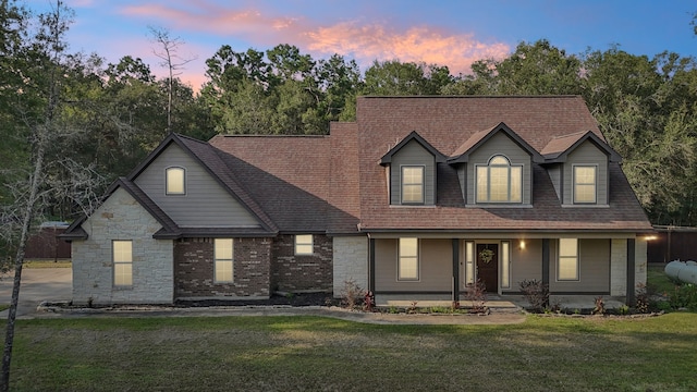 view of front of property with a yard