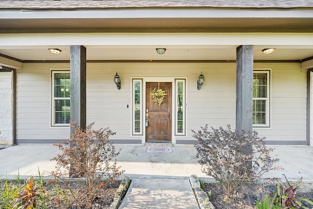 doorway to property with a porch