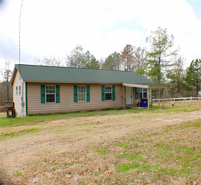 ranch-style house with a front lawn