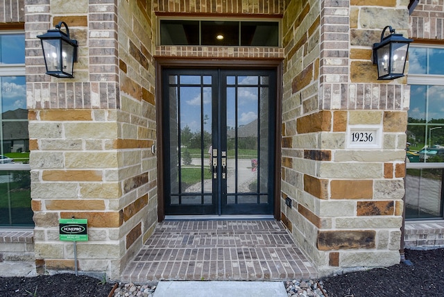 property entrance featuring french doors