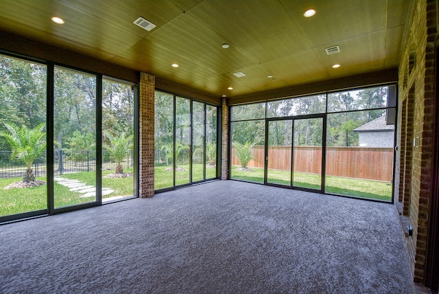 unfurnished sunroom featuring wood ceiling