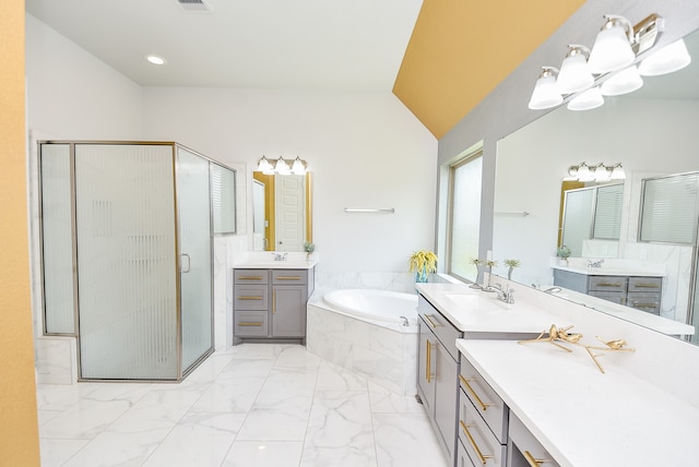 bathroom with double vanity, tile patterned floors, and separate shower and tub