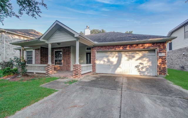 view of front of home with a porch and a garage