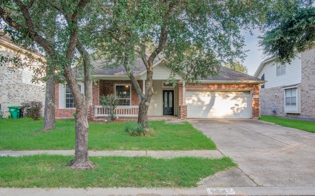 view of front of house featuring a front lawn and a garage