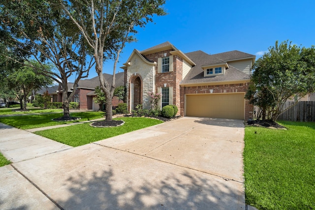 view of front of house with a front yard and a garage