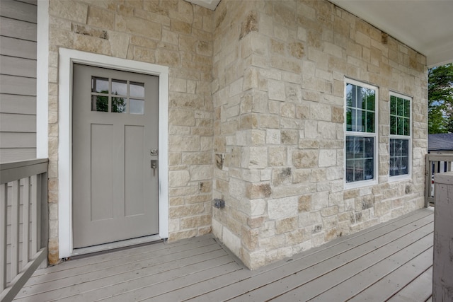 entrance to property with a wooden deck