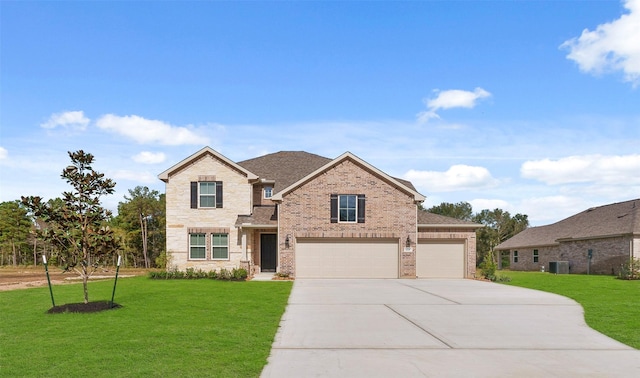 craftsman inspired home featuring a garage, cooling unit, and a front lawn