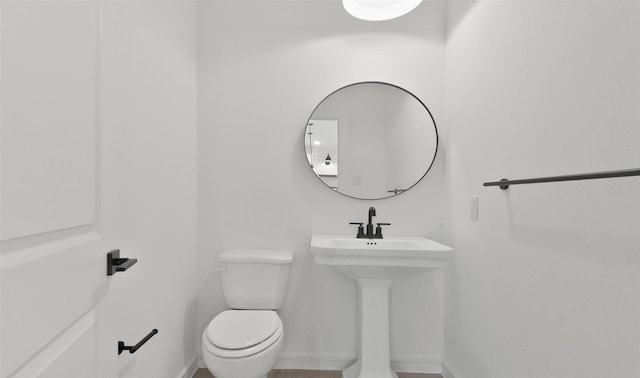 bathroom with sink and toilet