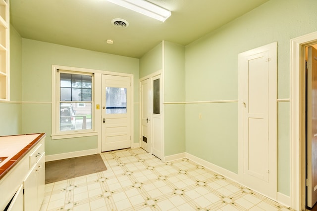 interior space featuring light tile patterned flooring
