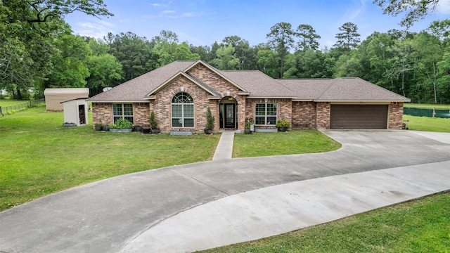 ranch-style house featuring a garage and a front yard