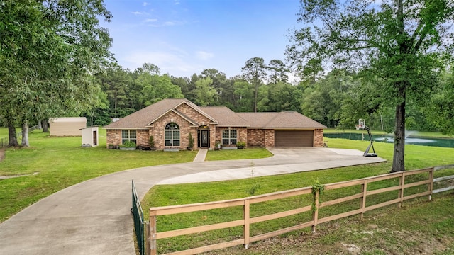 single story home featuring a garage and a front yard