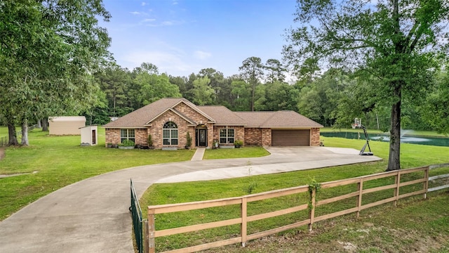 view of front of home with a fenced front yard, brick siding, concrete driveway, a garage, and a front lawn