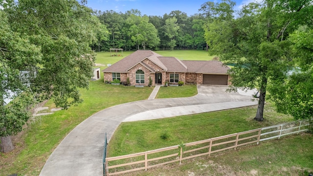 view of front of home featuring a garage and a front lawn