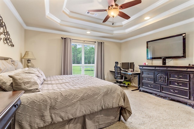 carpeted bedroom featuring ceiling fan, a raised ceiling, and ornamental molding