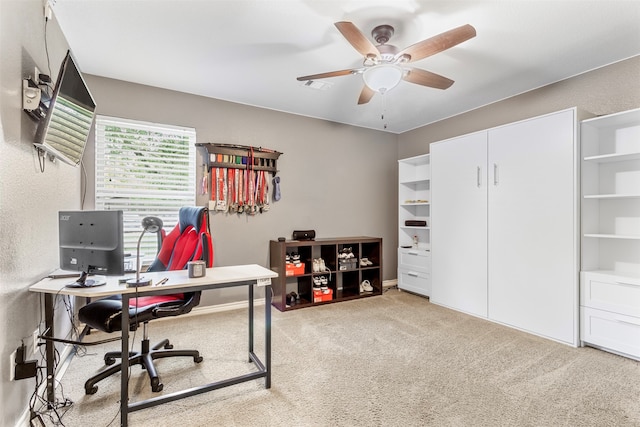 carpeted office with ceiling fan