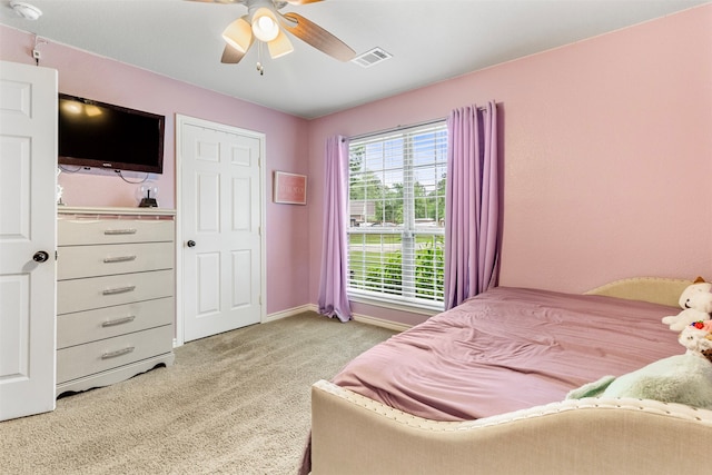 bedroom featuring ceiling fan and light colored carpet