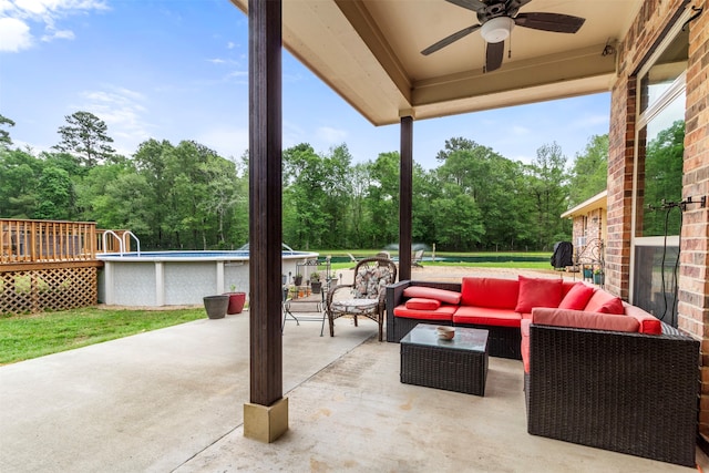 view of patio with ceiling fan and an outdoor hangout area