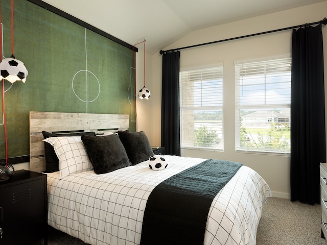 carpeted bedroom featuring vaulted ceiling