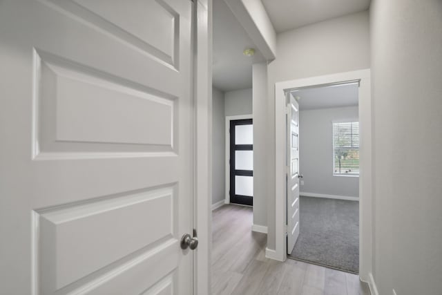 corridor featuring light hardwood / wood-style flooring