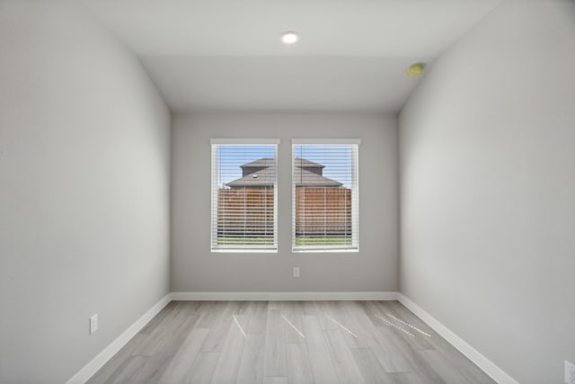 unfurnished room with light wood-type flooring