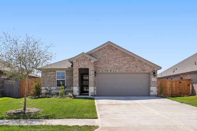 view of front facade with a garage and a front lawn