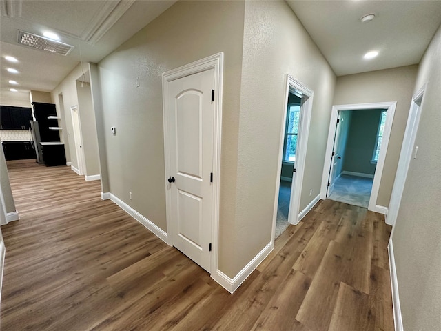 corridor with wood-type flooring