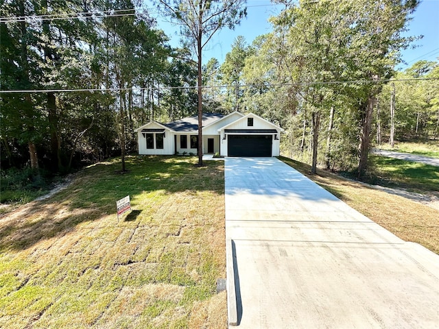 ranch-style house with a garage and a front lawn