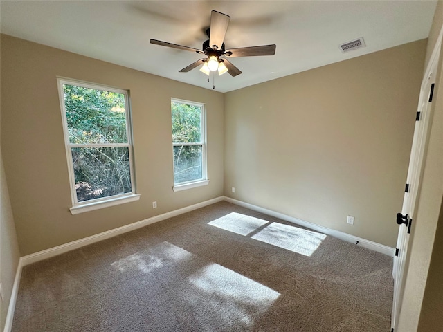 carpeted empty room with ceiling fan